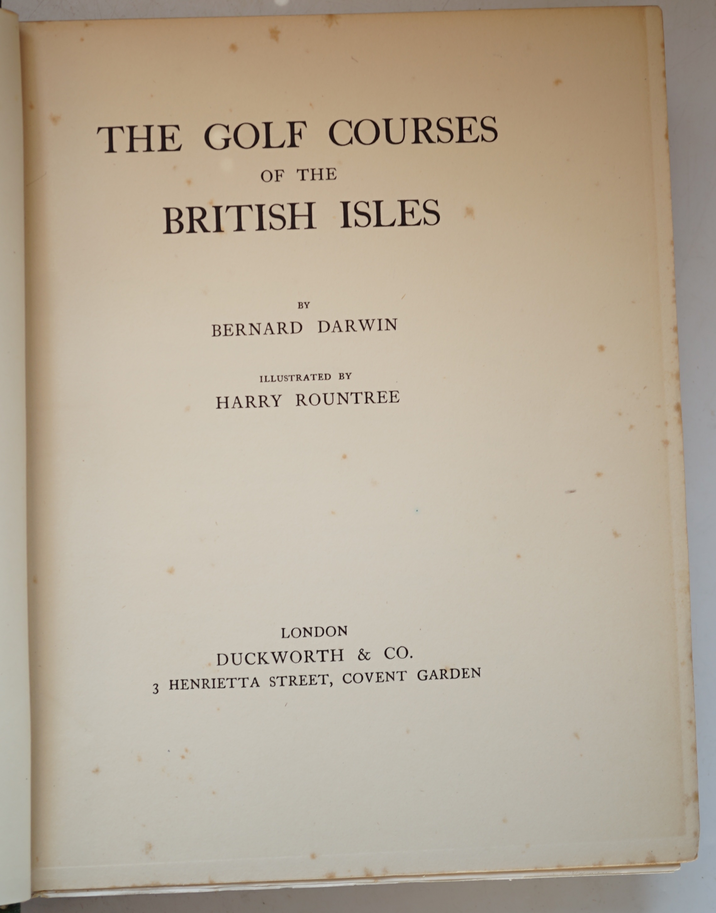 Darwin, Bernard - The Golf Courses of the British Isles, 1st edition, illustrated by Harry Rountree, with colour frontispiece and 44 colour plates, 4to, publisher's green pictorial cloth, some spotting, Duckworth, London